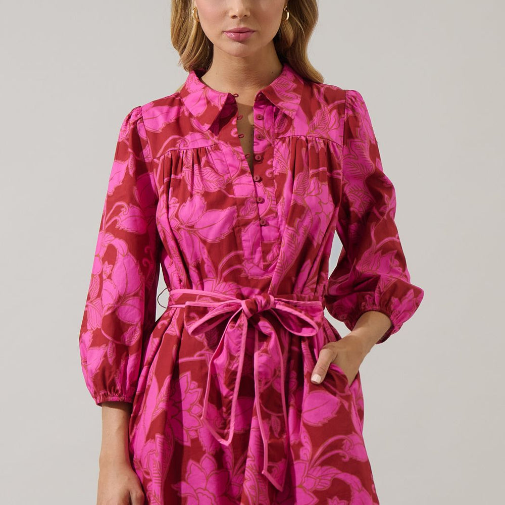 Woman wearing a pink floralm mini dress