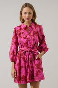 Woman wearing a pink floralm mini dress